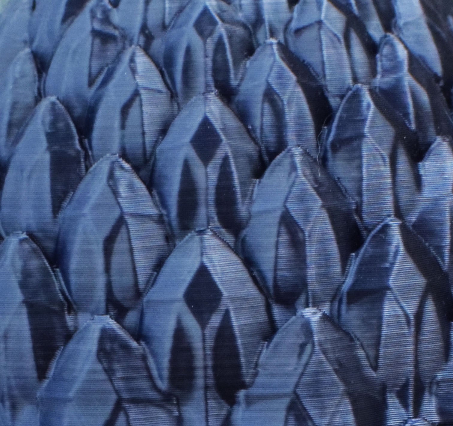 Close-up of black textured dragon egg with dragon scale pattern