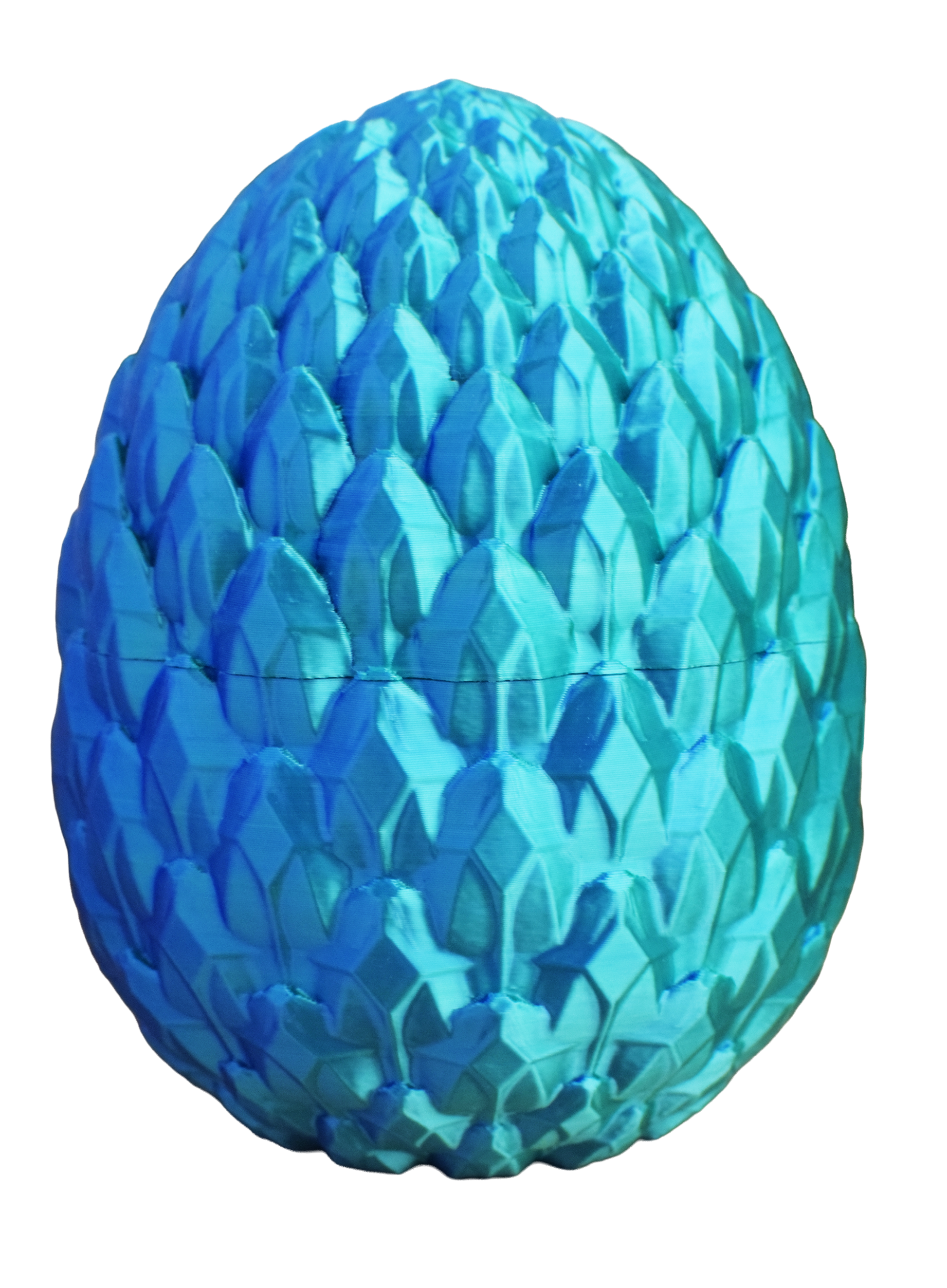 Blue textured dragon egg on a white background